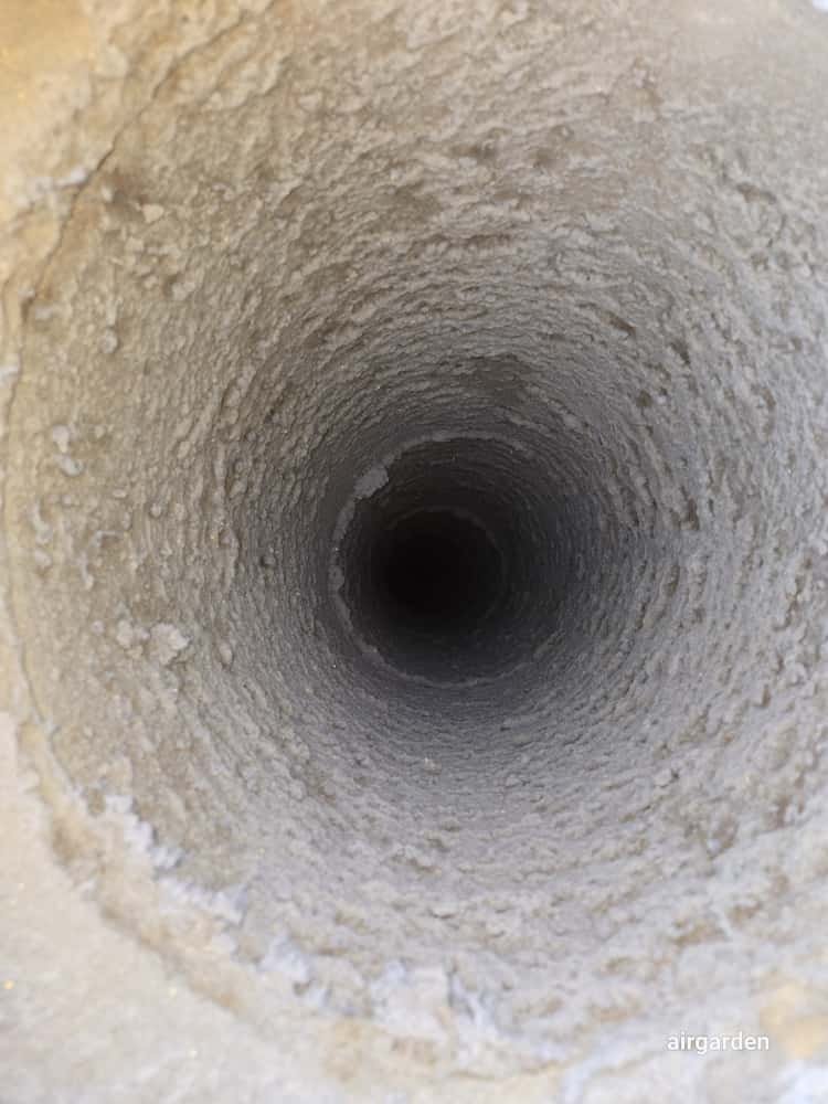 Inside view of dryer vent duct with lint buildup